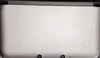 A close-up view of the top of a closed Nintendo 3DS XL handheld game console. Produktbild-Vorschau