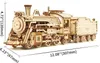 A 3D wooden model of a steam train with dimensions indicated. Podgląd zdjęcia produktu