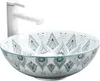 A white faucet is positioned behind a decorative round sink with a mandala pattern. Náhled obrázku produktu