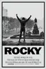 A black and white movie poster for Rocky, featuring Sylvester Stallone as Rocky Balboa with his arms raised in triumph in front of a statue. Produktbild-Vorschau