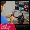 A man is using a rowing machine while holding a smartphone connected to the machine's screen. Produktbild-Vorschau