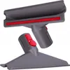 A close-up studio shot of a vacuum cleaner attachment set. Voir les images du produit