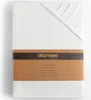 A folded white fitted sheet with a brown paper band around it. Produktbild-Vorschau