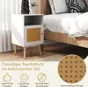 A white bedside table with a rattan door is placed next to a bed. Náhled obrázku produktu