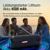 People enjoying music on a beach with a portable speaker. Produktbild-Vorschau