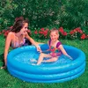Two people are in an inflatable pool in a garden. Náhled obrázku produktu