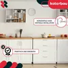 A kitchen scene showcasing white cabinets and drawers with gold handles, a wall shelf with kitchenware, and promotional text overlays. Produktbild-Vorschau