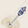A close-up view of an immersion blender with a cutaway showing its internal motor and gears, immersed in a frothy liquid. Produktbild-Vorschau