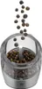 A pepper grinder with peppercorns falling into it. Anteprima dell’immagine prodotto