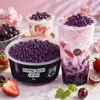 Drei lila Bubble-Tea-Getraenke mit Popping Boba Traube in Glaesern mit Strohhalm Podgląd zdjęcia produktu