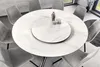 A round dining table with a lazy susan, surrounded by chairs in a modern dining room setting. Produktbild-Vorschau