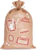 A burlap Santa sack with Christmas-themed stamps and text. Podgląd zdjęcia produktu