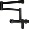 A black kitchen faucet with a foldable swivel arm, mounted on a wall. Podgląd zdjęcia produktu