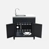 A black outdoor kitchen unit with a sink and faucet, shown with its cabinet doors open. Anteprima dell’immagine prodotto