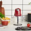 A red Russell Hobbs mini chopper is displayed on a kitchen counter with a bowl of salsa and tortilla chips. Produktbild-Vorschau