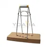 A stainless steel kitchen clamp is placed on a cardboard base against a white background. Produktbild-Vorschau