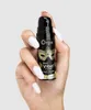 A hand holding a small bottle of intimate gel. Anteprima dell’immagine prodotto