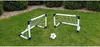 Two small soccer goals and a soccer ball are set up on a grassy lawn. Voir les images du produit