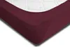 A close-up view of a burgundy fitted sheet on a white mattress. Produktbild-Vorschau