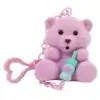 A pink teddy bear keychain holding a light blue bottle. Anteprima dell’immagine prodotto