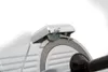 A close-up view of the blade and sharpening mechanism of a food slicer. Náhled obrázku produktu