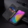 A black flip-style phone case with cards and money inserted, placed on a dark surface next to a smartwatch. Produktbild-Vorschau