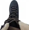 A top-down view of a blue hiking boot with brown laces and cream-colored fur lining. Produktbild-Vorschau