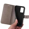 A hand is holding a gray flip phone case open, revealing the black interior where a phone would be placed. Produktbild-Vorschau