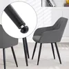 A close-up view of the adjustable foot of a dark gray dining chair with black metal legs, set in a room with a bookshelf in the background. Produktbild-Vorschau