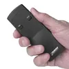 A hand holding a black remote control. Náhled obrázku produktu
