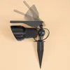 A black solar-powered spotlight with an adjustable head and a ground stake, shown against a plain beige background. Produktbild-Vorschau