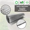 A roll of silver insulating foil with a bubble wrap texture, set against a blurred background of a greenhouse or tunnel structure with green plants. Náhled obrázku produktu