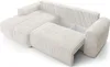A cream-colored sectional sofa with its storage compartment open, shown from a slightly elevated angle against a white background. Podgląd zdjęcia produktu