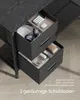Close-up view of two open drawers of a black desk, showing office supplies and accessories neatly organized within. Produktbild-Vorschau