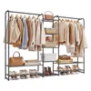 A multi-tiered garment rack with various clothing items, bags, and shoes displayed. Náhled obrázku produktu