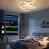 A bedroom scene at night with a child sleeping in bed, illuminated by a modern ceiling light. Produktbild-Vorschau