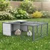 Two rabbits are in a large outdoor enclosure on a grassy lawn with flowers. Produktbild-Vorschau