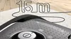 A close-up of a vacuum cleaner's top with text indicating its active radius. Produktbild-Vorschau