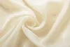 A close-up, swirled view of sheer, cream-colored fabric. Produktbild-Vorschau