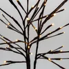 Close-up view of artificial tree branches with LED lights. Produktbild-Vorschau