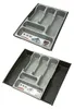Two views of a gray cutlery organizer tray with multiple compartments, shown on a light gray background. Produktbild-Vorschau