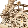 A close-up view of a wooden marble run toy with gears and tracks. Náhľad obrázku produktu
