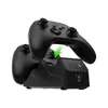 A black dual controller charging station with two black controllers being docked. Produktbild-Vorschau