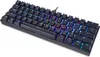 A black mechanical keyboard with RGB backlighting is shown from a diagonal angle against a white background. Podgląd zdjęcia produktu