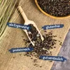 Buckwheat seeds on a burlap cloth with descriptive text overlays. Produktbild-Vorschau