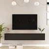 A modern living room setup featuring a wall-mounted TV stand with a television above it, decorated with plants and books. Náhled obrázku produktu