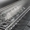 A close-up, angled view of a stainless steel grill grate. Produktbild-Vorschau