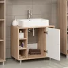 A bathroom vanity with a sink and open cabinet. Náhled obrázku produktu