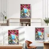 A collage of images showcasing a framed painting of a scenic pathway leading to the sea, with multiple views and settings. Produktbild-Vorschau