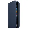 A dark blue leather flip case for an iPhone is shown from the side, with the flip cover partially open to reveal the phone screen. Produktbild-Vorschau